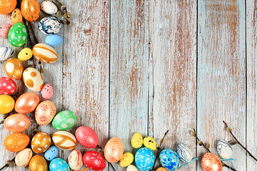 Composition with decorated Easter eggs and willow branches. Happy Easter concept, banner or advertisement for screen or store, template for design, spring card,