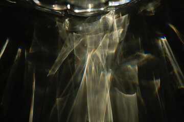 reflections of water in a drinking glass on a acryl surface