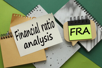 Financial Ratio Analysis different pages on a green background. text on paper