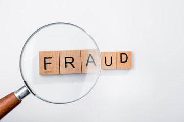 Fraud with magnifying glass