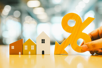 Wood house and Percentage model, selective focus, Planning to buy property. Choose what's the best....
