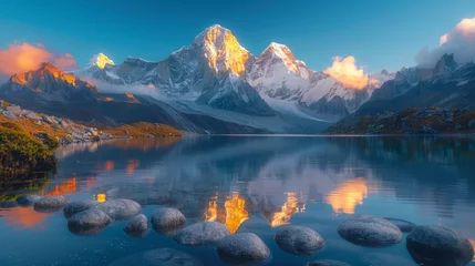Cercles muraux Himalaya Beautiful landscape with high mountains with illuminated peaks, stones in mountain lake, reflection, blue sky and yellow sunlight in sunrise. Nepal. Amazing scene with Himalayan mountains. Himalayas.