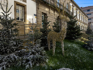 Winter Wonderland: Festive Reindeer Amidst Snow-Dusted Trees