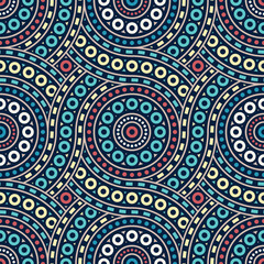 Ornamental geometric drawing with concentric striped circles decorated with small little dots and rings. Ethnic style with vintage colors. Abstract background. Seamless repeating pattern.