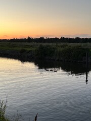 Obraz premium sunset on the river