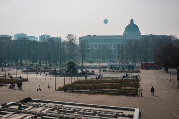 Alexanderplatz square in Berlin on a sunny spring day. Looking ferom the side towards center, hazy...