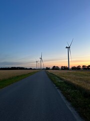 wind turbines at sunset
