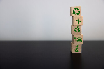 Stack wood cube block, global warming and climate change, offset by planting tree. Net zero...