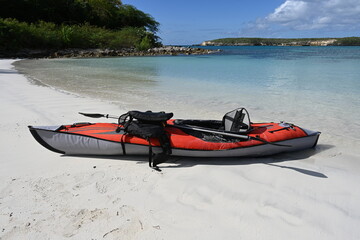 Adventure tourism - kayak on a beach.