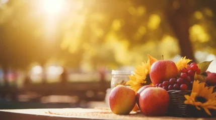 Poster Assorted fresh fruits on wooden table. Rustic autumn harvest daylight scene with sunlight © chelmicky
