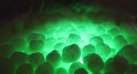 polystirene balls , green glowing  light background