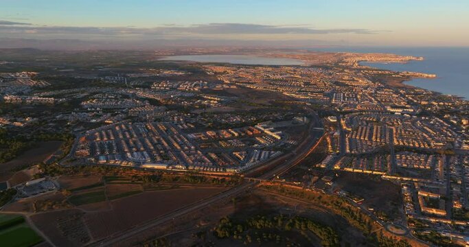 Aerial view of the beaches and coves of Torrevieja at sunset, Alicante province, Spain