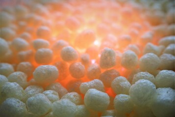 polystirene balls , textured glowing background