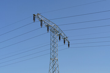 High Voltage Power Line Against Blue Sky