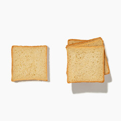 A stack of white toasted bread on a white isolated background