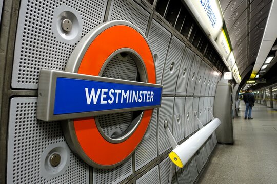 Westminster London Underground tube station roundel sign on the platform

