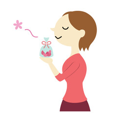 匂い袋の香りを楽しむショートヘアの女性　主線なし