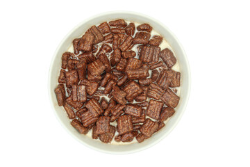 Bowl full of milk and chocolate cereals isolated on white background
