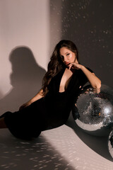 beautiful pregnant woman with dark hair in elegant clothes posing in studio - 750909175