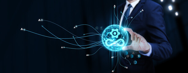 DevOps: Businessman Touching Digital Global Network of DevOps Data Exchange. Continuous Deployment...