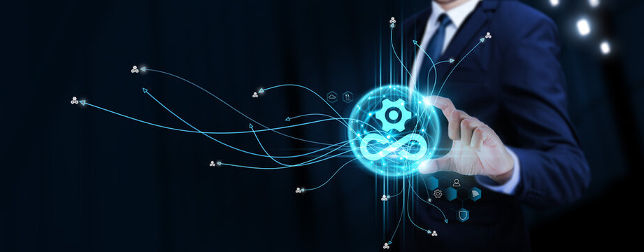 DevOps: Businessman Touching Digital Global Network of DevOps Data Exchange. Continuous Deployment on Social Network Connection with Hologram Modern Interface, Agile Development.