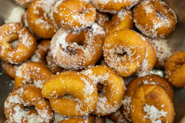 Closeups pile of homemade rosquillas, a traditional dessert made in Easter in Spain, similar to donuts.