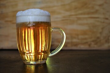 large pint of beer in background