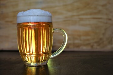 large pint of beer in background