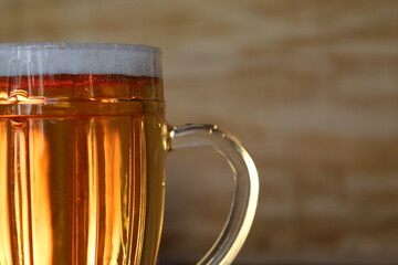 large pint of beer in background