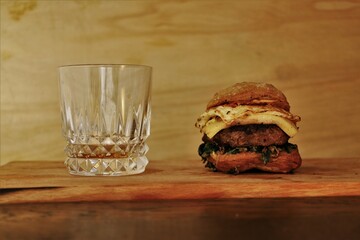 rustic burger and glass of coke