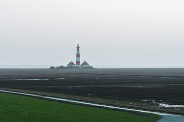 Westerheversand lighthouse on the North Sea a landmark of the Eiderstedt peninsula in Germany.