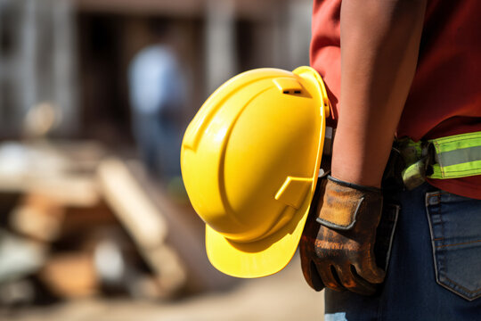 builders helmet, Safety workwear concept, safety helmet, Male hand holding, construction helmet, copy space