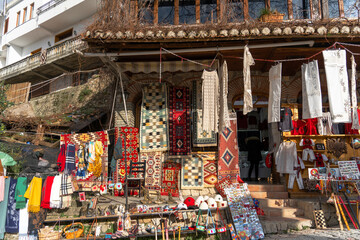 Kruja old bazar with traditional carpet in  Albania in afternoon sky 3 march 2024 - obrazy, fototapety, plakaty