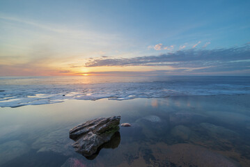 Serene coastal sunset in early spring time - 750934140
