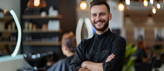 young man hairdresser smiling at camera