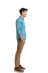 side view of relaxed casual man waiting in line