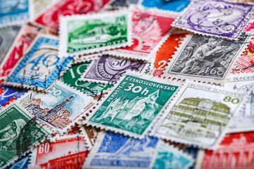 Postage stamps.A collection of world stamps in a pile.Postage stamps from different countries and...