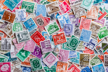 Fototapeta na wymiar Ukraine, Kiyiv - January 12, 2023 Finland Postage stamps..Postage stamps.A collection of world stamps in a pile.Postage stamps from different countries and times