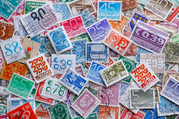 Ukraine, Kiyiv - January 12, 2023 Israeli Postage stamp.Postage stamps.A collection of world stamps in a pile.Postage stamps from different countries and times