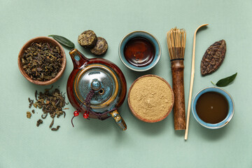 Composition with matcha tea and accessories on olive background