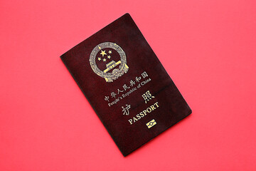 Red passport of People Republic of China. PRC chinese passport on bright background close up