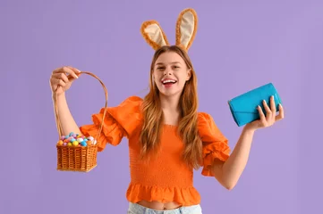  Young woman in bunny ears with eggs and wallet on lilac background. Easter Sale © Pixel-Shot