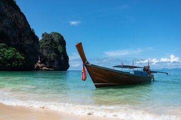 Fototapeta na wymiar longtail boat standing near the shore in Thailand
