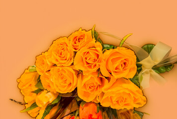Bouquet of beautiful yellow roses on Peach Fuzz background, fresh yellow roses
