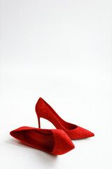 Elegant Red Suede High Heels Isolated on a White Background