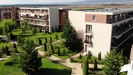 Panoramic aerial view of architectural complex of new residential houses in Bulgaria on Sunny Beach. Hotels and apartments with swimming pool. Summer holiday in Europe. Aerial photography, drone view.