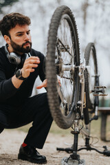 A focused businessman in casual attire repairs his mountain bike in an outdoor setting,...