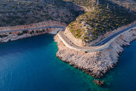 Coastline road, car travel along the shore Mediterranean sea in Turkey. Aerial view