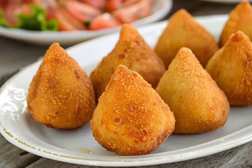 Foto op Aluminium Coxinha. Traditional Brazilian snack stuffed with meat or chicken. © Felippe Lopes
