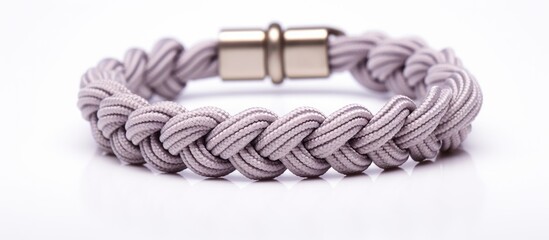 A braid bracelet with a metal clasp is elegantly displayed on a clean white background. The bracelet is intricately woven with durable rope, highlighting its stylish design.
